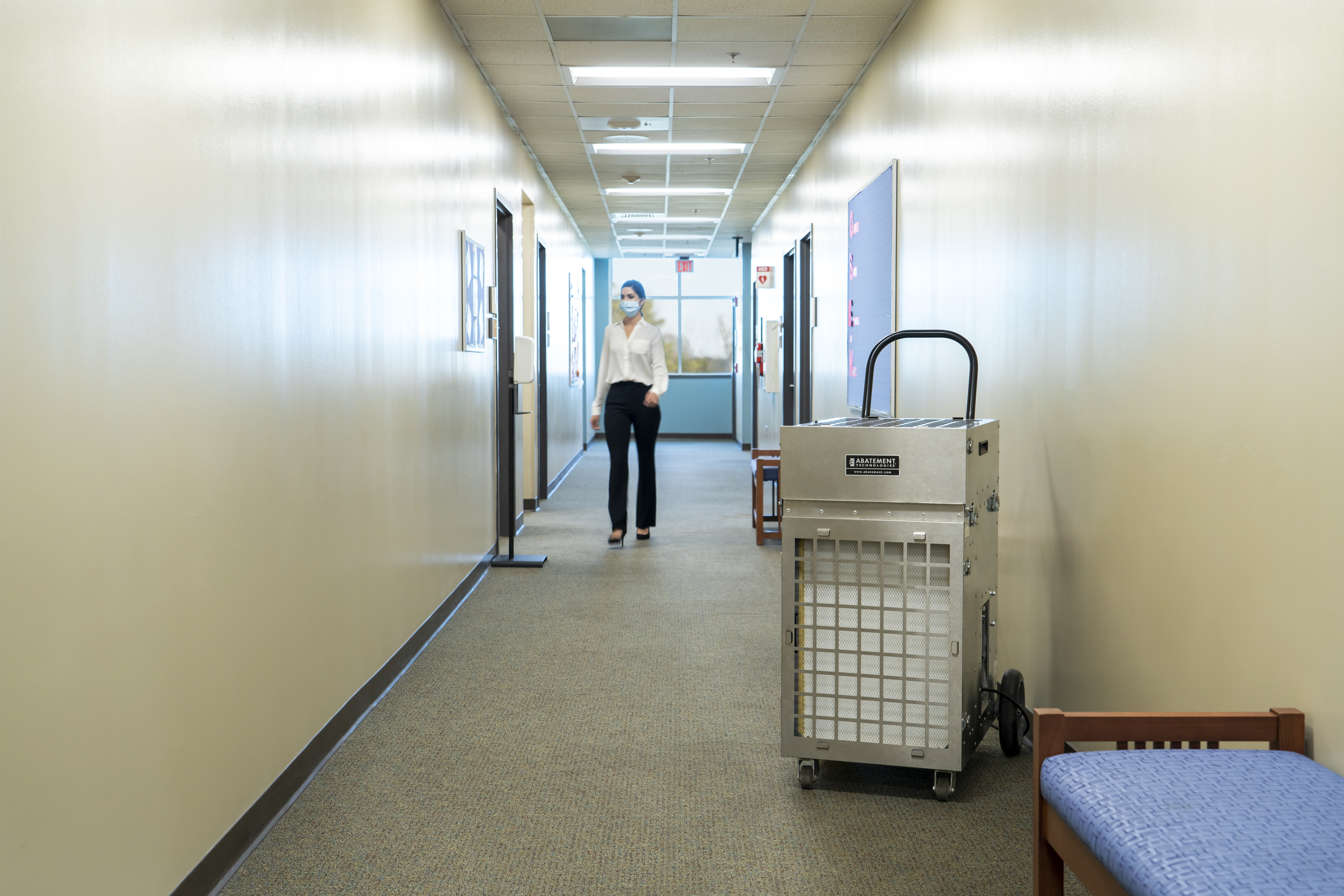 An air scrubber in the hallway of a medical building.