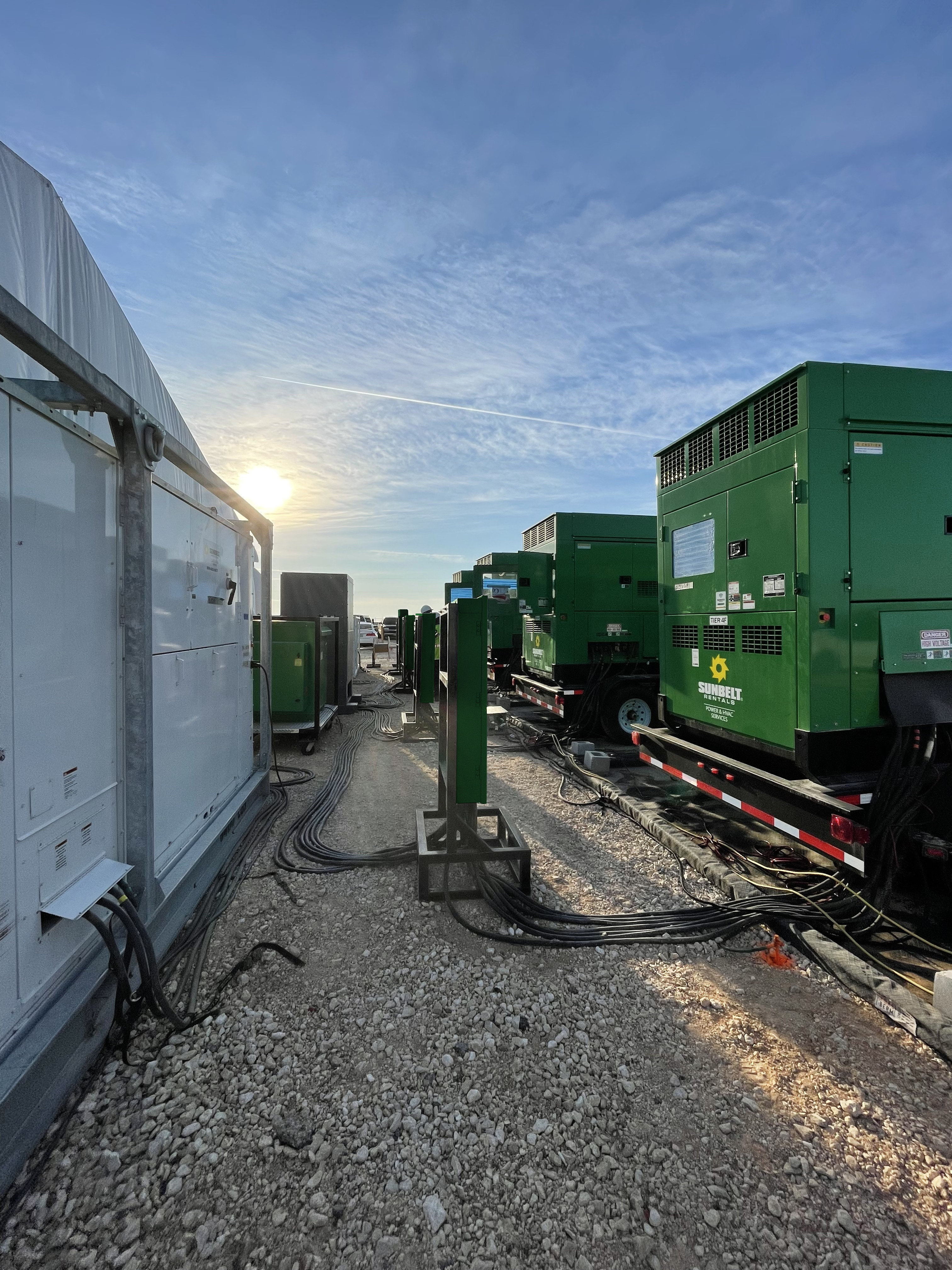 Generators from Sunbelt Rentals installed at a job site.