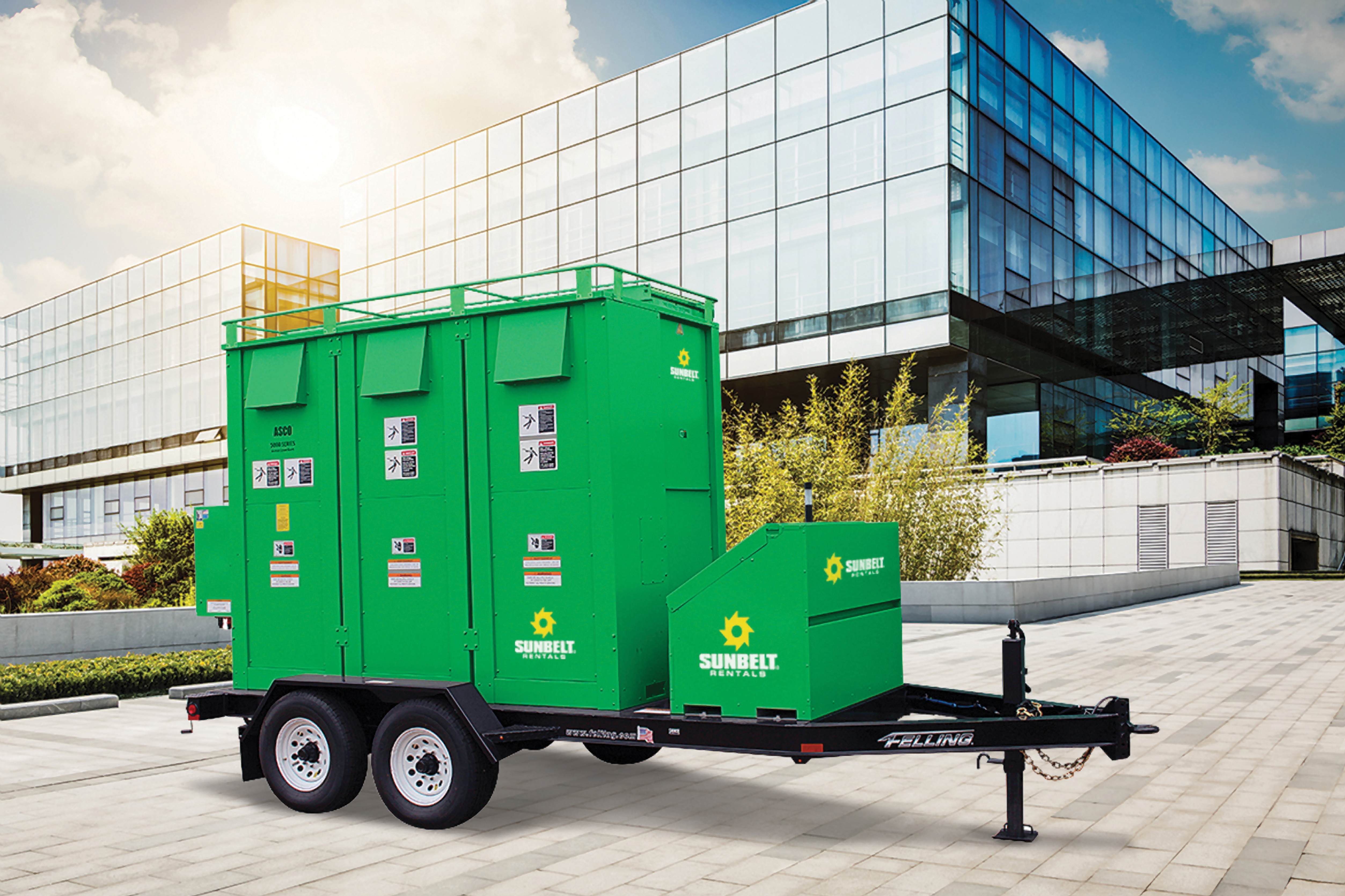 A resistive load bank from Sunbelt Rentals, in front of a high-rise building.