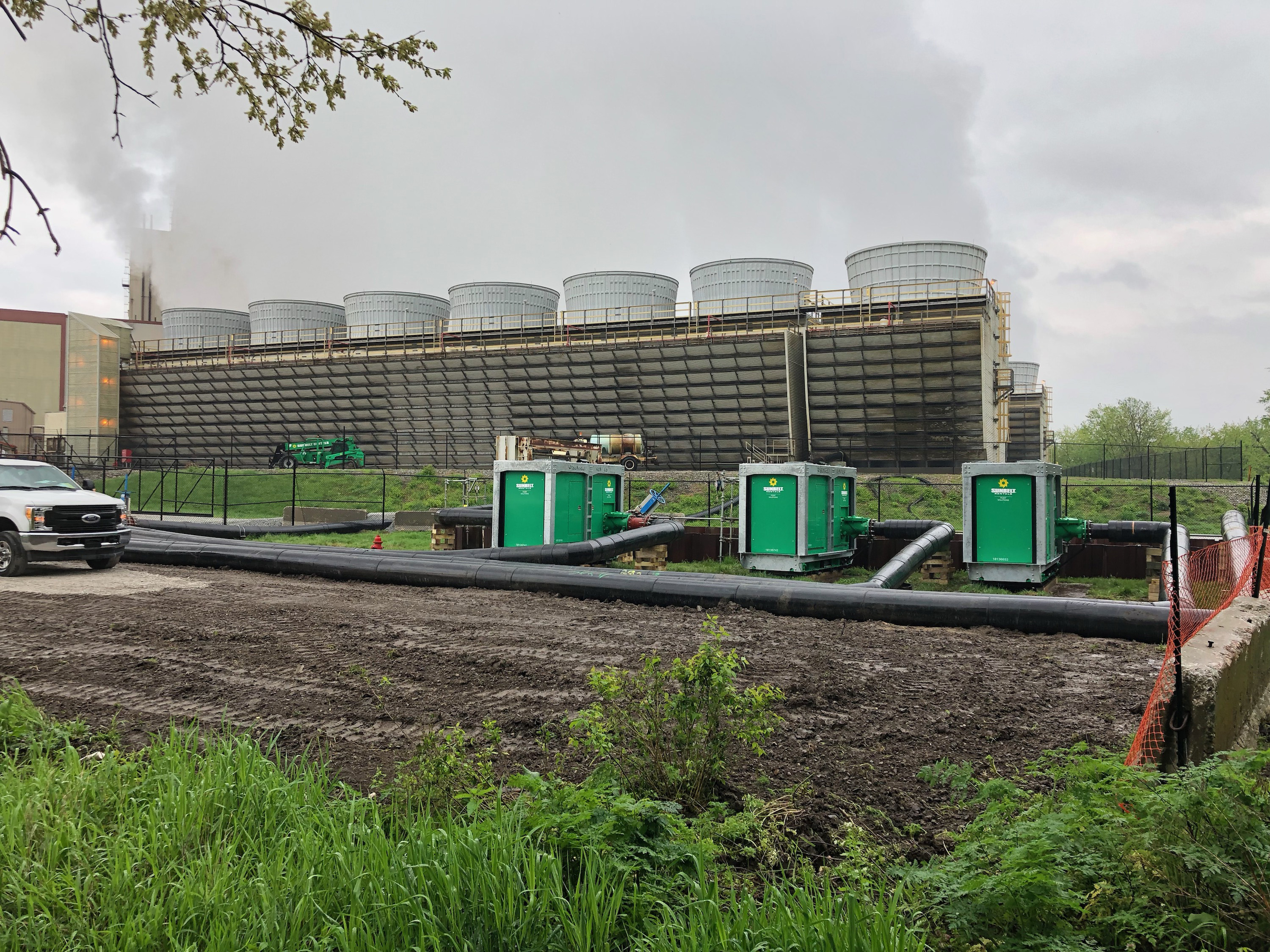 Pumps from Sunbelt Rentals outside of an industrial facility.